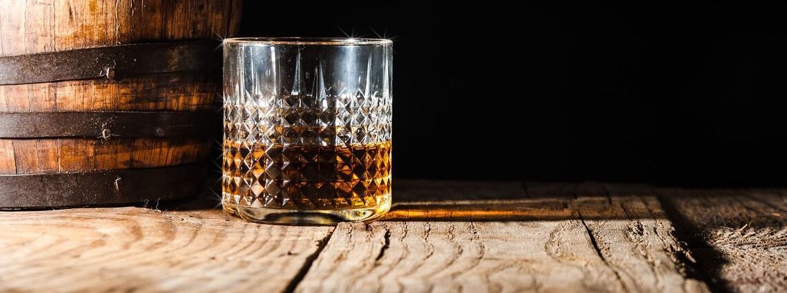Whiskey glass and barrel